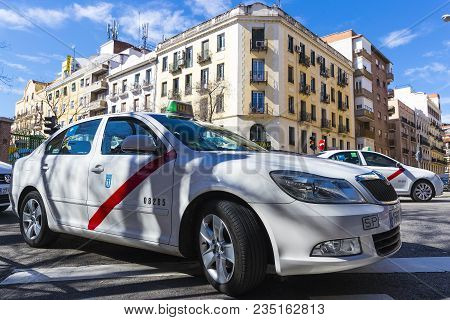 Madrid, Spain - 27 March, 2018: Taxi Of The White Color Of The City Of Madrid On City Streets.