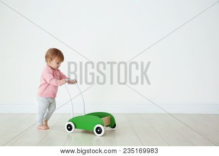 Cute Baby Playing With Toy Walker, Indoors