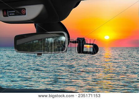 Looking Through A Dashcam Car Camera Installed On A Windshield With View Of A Scenic Sunset On The M