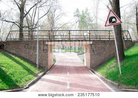Bridge In The Park Of Culture And Rest Above The Bicycle Road