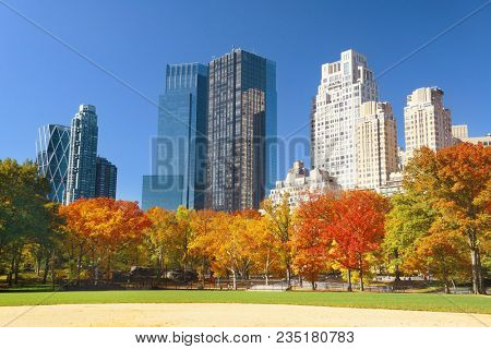 Manhattan midtown skyline viewed from central park in Autumn in New York City.