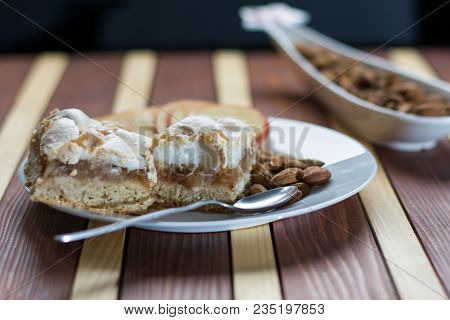 Square Shape Sliced Omemade Apple Pie With Kumquats And Almonds