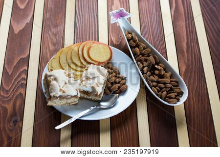 Square Shape Sliced Omemade Apple Pie With Kumquats And Almonds