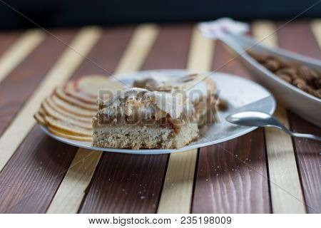 Square Shape Sliced Omemade Apple Pie With Kumquats And Almonds