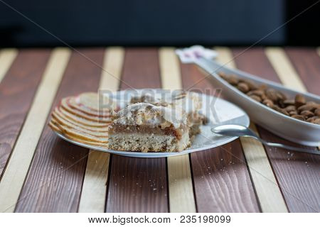 Square Shape Sliced Omemade Apple Pie With Kumquats And Almonds