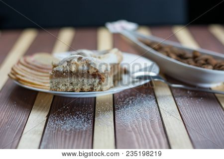 Square Shape Sliced Omemade Apple Pie With Kumquats And Almonds