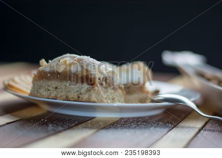 Square Shape Sliced Omemade Apple Pie With Kumquats And Almonds