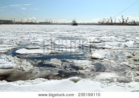 Spring Has Come.the Ice In The Lake Began To Melt.pieces Of Ice Float On Water, Forming An Ice Drift