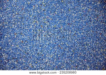 Texture Of A Colored Granular Sand Close Up. Blue Grains