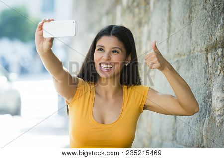 Latin Woman Taking Selfie While On Holidays In Madrid