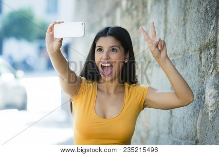 Latin Woman Taking Selfie While On Holidays In Madrid