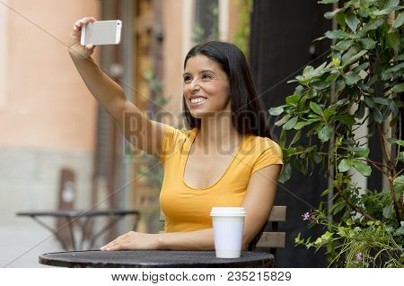 Attractive Brunet Latin Woman Smiling And Being Happy While Taking A Selfie On Holidays In Spain In 