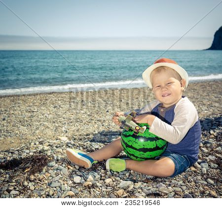 Cute caucasian boy at seaside. Leisure time