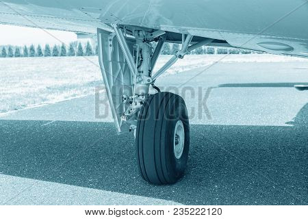 Wheel Of Airplane. Close Up Of Aircraft Wheel On Runway. Plane Wheel, Jet Plane, Blue Colored