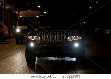 Road In The City At The Night With Yellow And Red Electrical Light For Cars During They Are Coming H