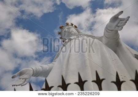 Mary Virgin Monument In Lebanon Named Harissa On Blue Sky Background. Lady Of Lebanon Statue