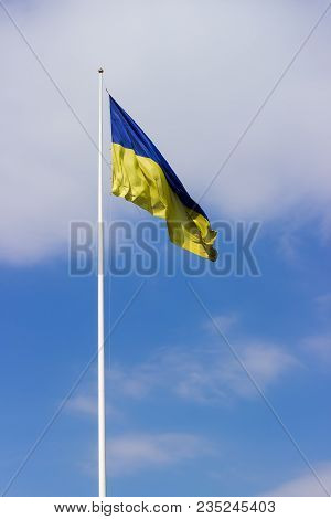 National Flag Of Ukraine Consisting Of Horizontal Bands Of Blue And Yellow Colors Flying In The Wind