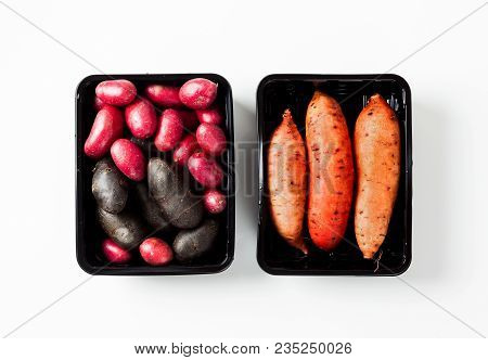 Different Varieties In Form And Color Of Potatoes  On A White Isolated Background. Red, Shetland Bla