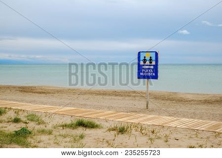 Indicator On The Empty Beach, Nudist Beach
