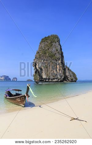 Railay Beach, Krabi, Thailand - April 8 2015 Traditional Wooden Longtail Boat Anchored On Railay Bea
