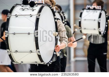 Musicians March, Play And Make Music With Large Bass Drums