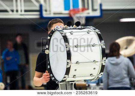 Musicians March, Play And Make Music With Large Bass Drums