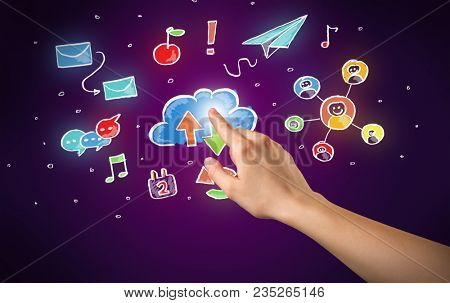 Female hand toucing mixed media icons with purple background