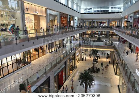 Dubai, Uae - November 22, 2017: Shoppers Visit Dubai Mall. It Is The Largest Mall In The World By To