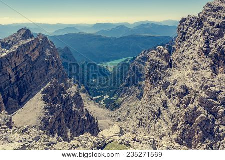 View Of A Lake Through Mountain Pass. Molveno Under Brenta Dolomites.