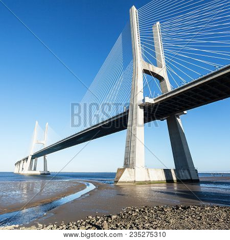 Vasco Da Gama Bridge In Lisbon, Portugal. Photo Afternoon On A Sunny Day