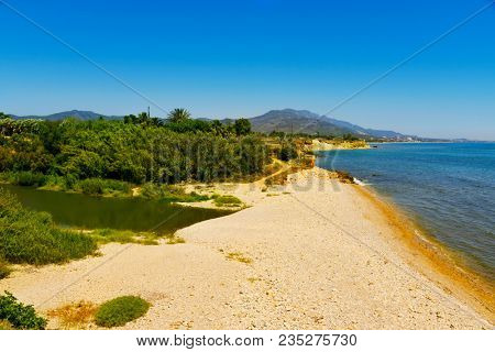 a view of the mouth of the Senia River between Alcanar and Vinaros, in Spain