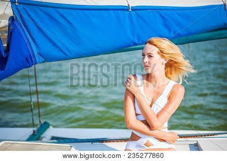 Woman Sitting On Sail Boat Or Yacht