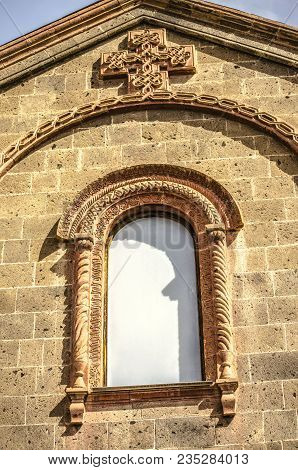 Window Under The Roof,covered With A Patterned Oval Cornice And Openwork Cross On Church St. Mesrop 