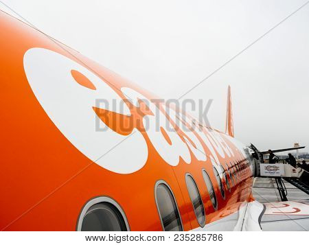 Hamburg, Germany - Mar 22, 2018: Wide Logo Of People Entering Easyjet Airplane Early In The Morning 