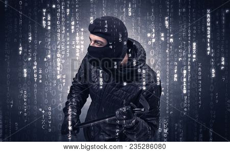 Burglar in action with encoded concept and his tools in his hand. 