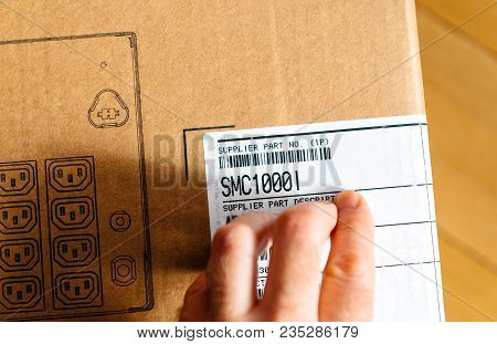 Paris, France - Mar 29, 2018: Man Inspecting Barcode Of Apc Smart-ups Smc 1000va Lcd 230v Enterprise