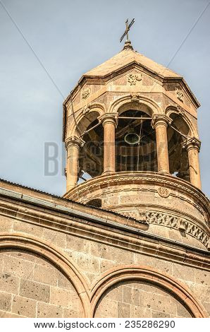 View Of Cylindrical Bell Tower With A Forged Cross In Of The Church Of St.mesrop Mashtots In The Vil