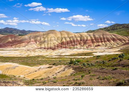 The Oregon Painted Hills. Bold Red Sandy Soil Makes Stripes Through The Hills, Alternating Red, Blac
