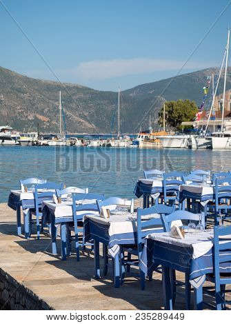 Tables By The Sea In A Greek Island