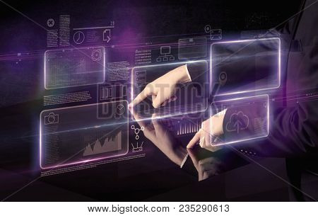 Male hands touching interactive table with purple cloudspace graphic on it 