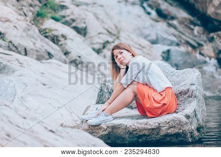 Beautiful Young Woman Relaxing In The Nauture On The Spring Day