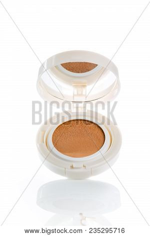Foundation Cushion With A Tonal Base Pouring Out Of Puff On White Background