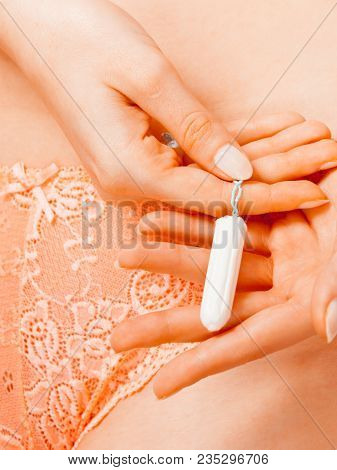 Women Hygiene Protection Concept. Part Body Woman With Tampon. Girl In Lacy Lingerie On Time Of Mens