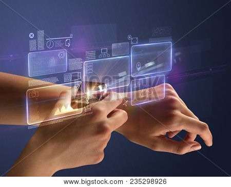 Female hand wearing smartwatch with statement labels around and dark background
