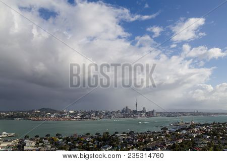 Photograph Of A Big Dark Cloud Over Auckland Skyline As Seen From Devonport.