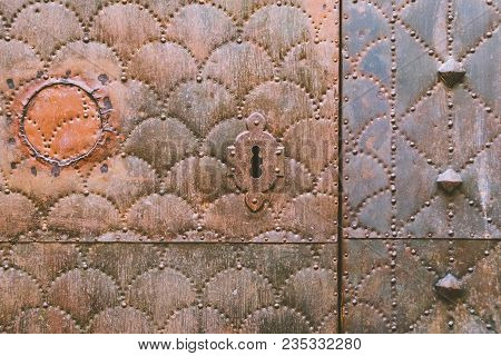 Ancient Gate With Lock Of A Monastery In Spain