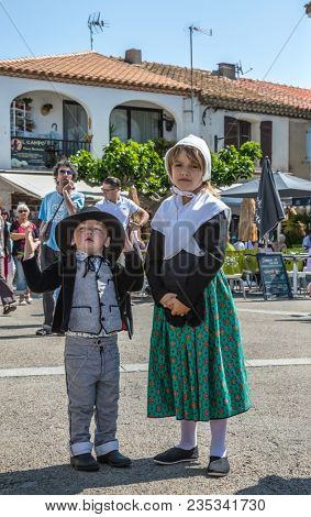 Saint-Marie-de-la-Mer, Provence, France - May 25, 2015. Children in fabulously medieval clothes. The gypsies feast of St. Sara. The concept of ethnographic tourism 