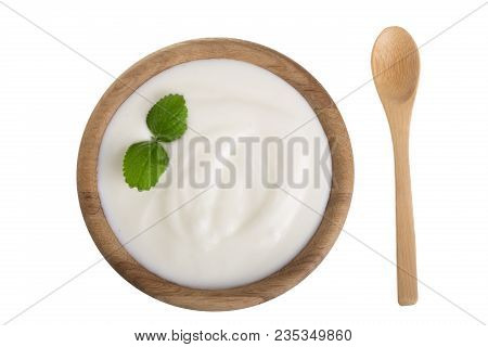 Yogurt In A Wooden Bowl With Mint Leaf Isolated On White Background Top View.