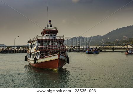 Typical Passenger Boat On The Island Of Koh Samui In The Gulf Of Thailand. Behind Are The Docks And 