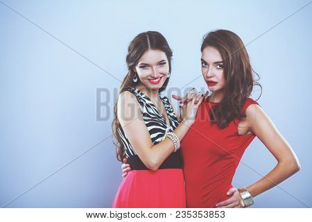 Two young beauty women standing together . Two young beauty wome